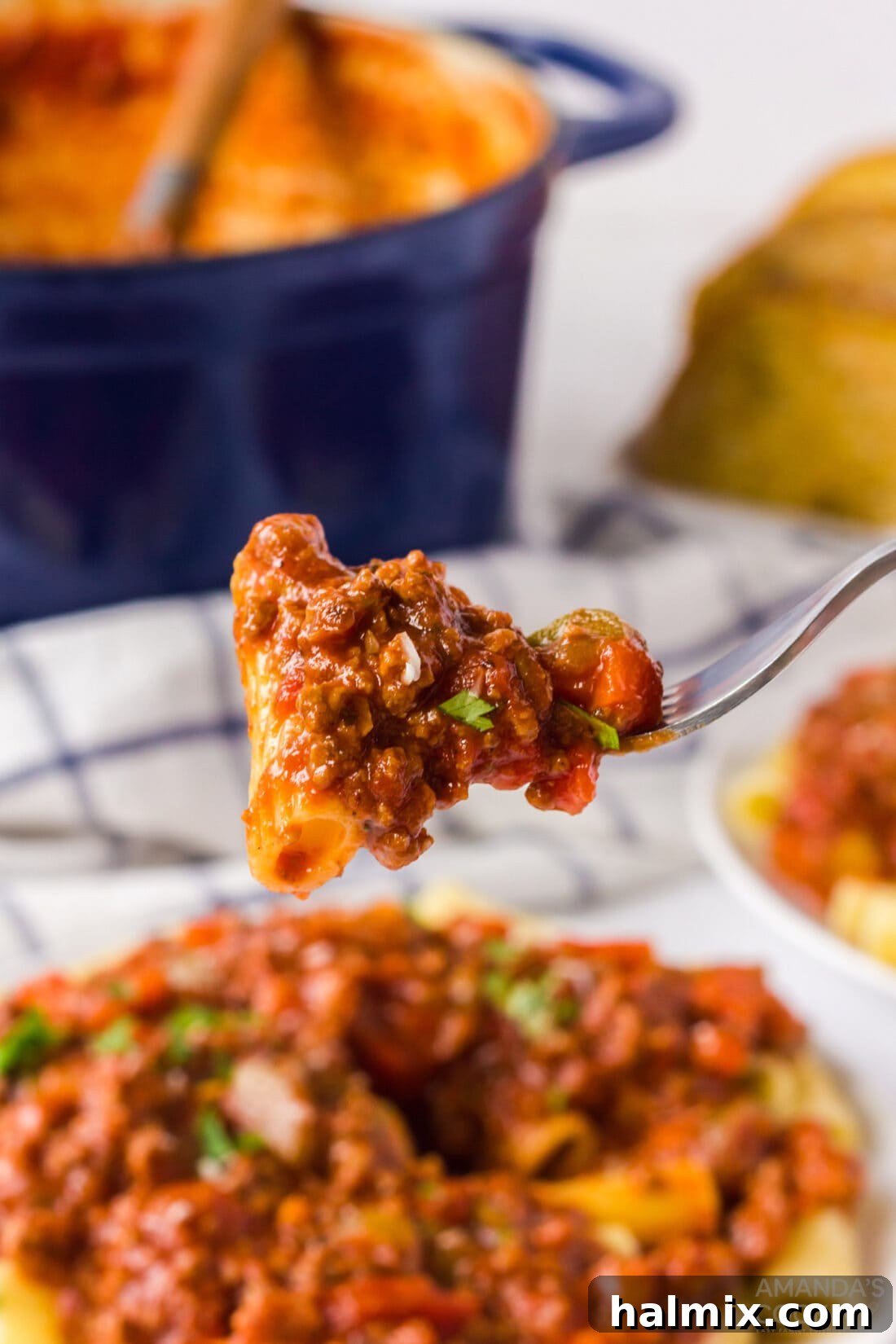 fork full of bolognese pasta