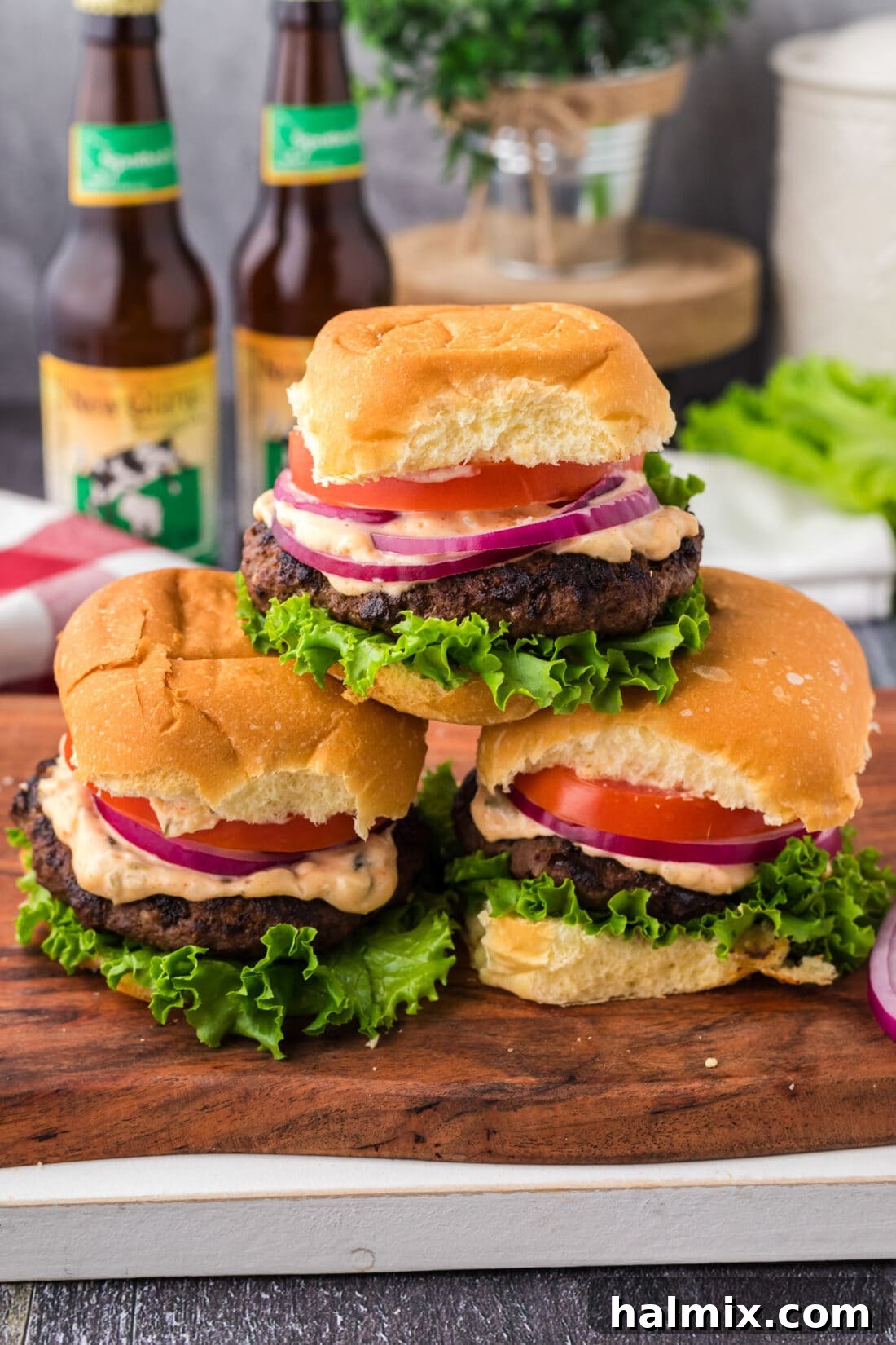 Mighty Buffalo Burger 3 A stack of perfectly cooked Buffalo Burgers, glistening and ready to be assembled into delicious sandwiches.
