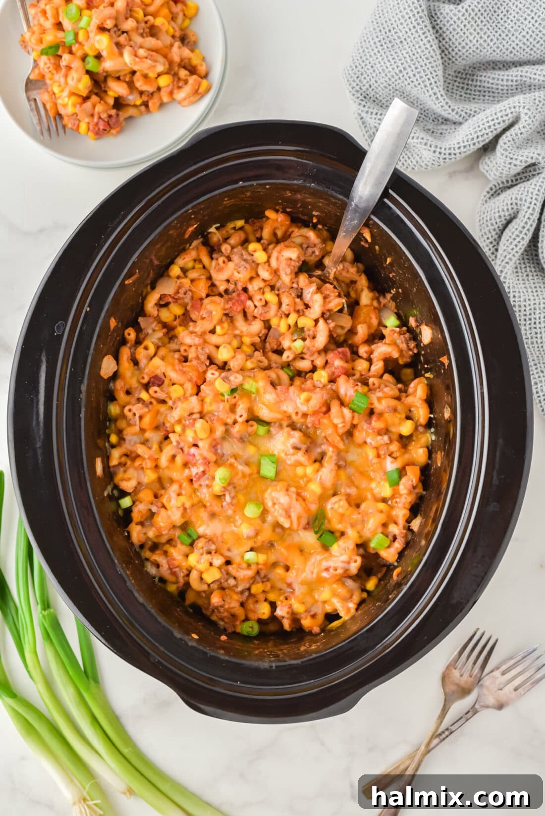 Unlocking Your Slow Cooker's Potential 3 An overhead shot of a bubbling Crockpot Ground Beef Casserole, ready to be served from the slow cooker.
