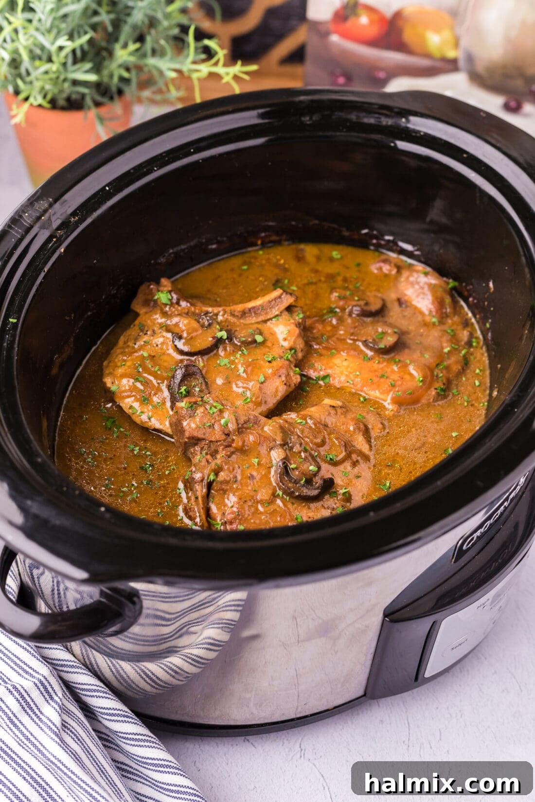 Unlocking Your Slow Cooker's Potential 7 Beautifully cooked Crockpot Pork Chops nestled among vegetables, ready for a comforting meal.