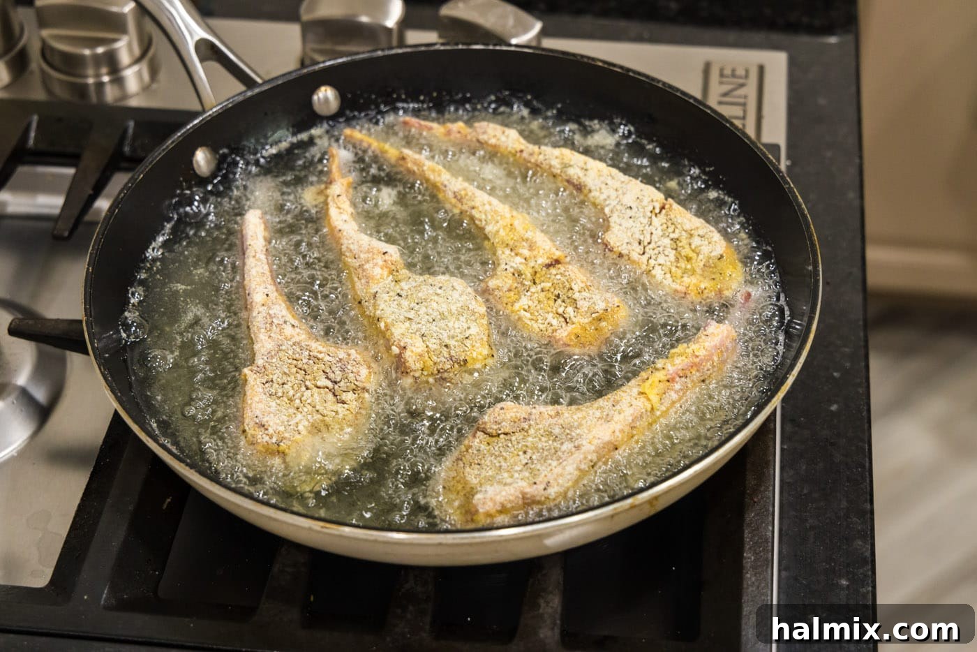 Golden Fried Lamb Perfection 11 dredged lamb chops frying in oil