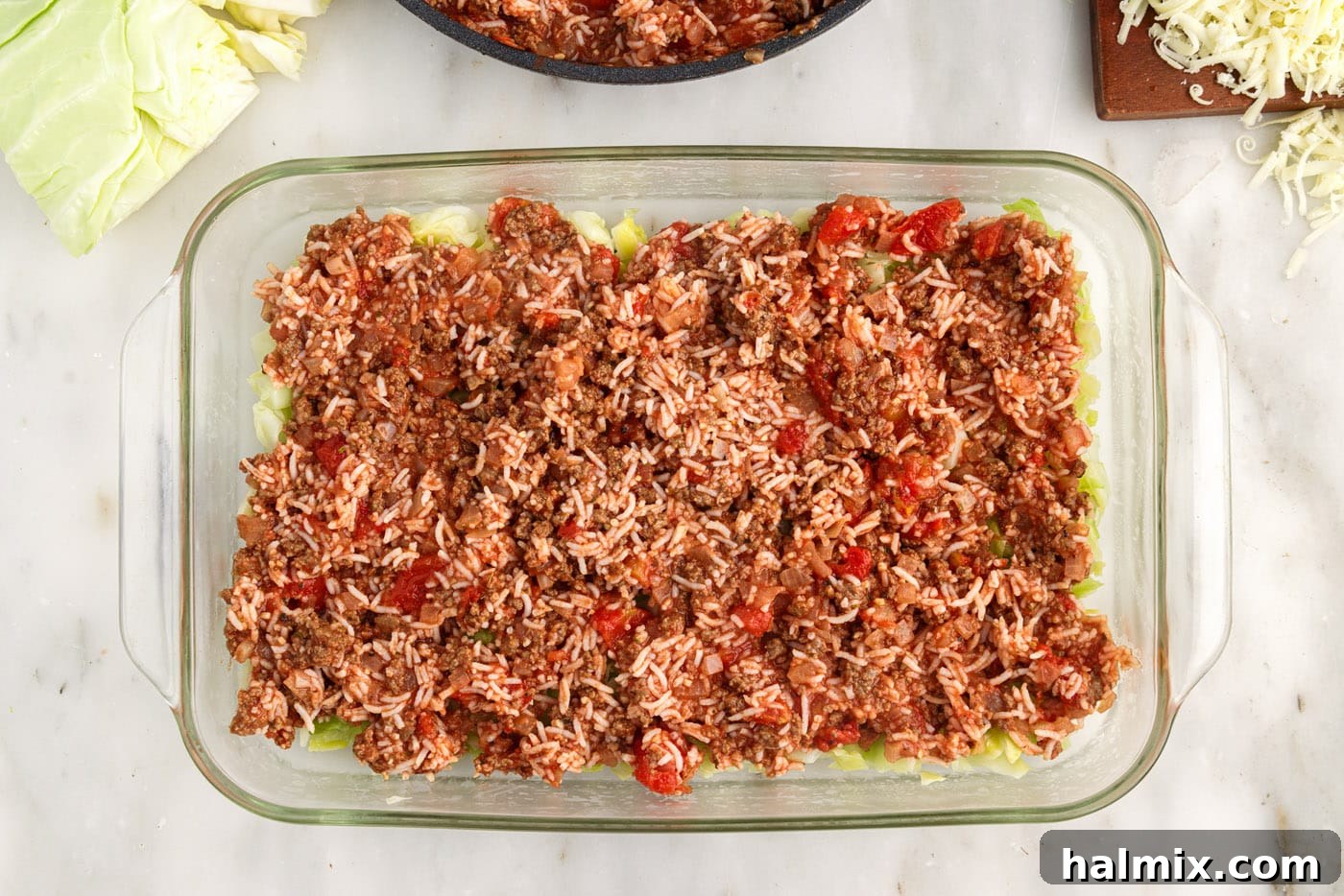 Hearty Unstuffed Cabbage Casserole 12 ground beef and rice mixture on top of cabbage in a dish