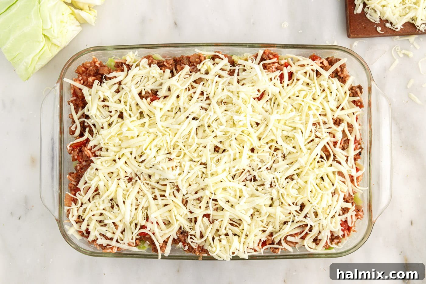 Hearty Unstuffed Cabbage Casserole 13 shredded cheese on top of cabbage roll casserole