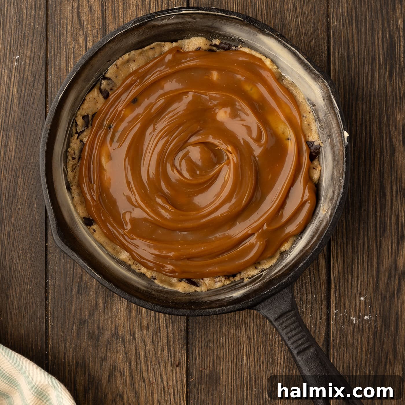 Decadent Caramel Chocolate Skillet 15 layer of salted caramel sauce over cookie dough in a skillet