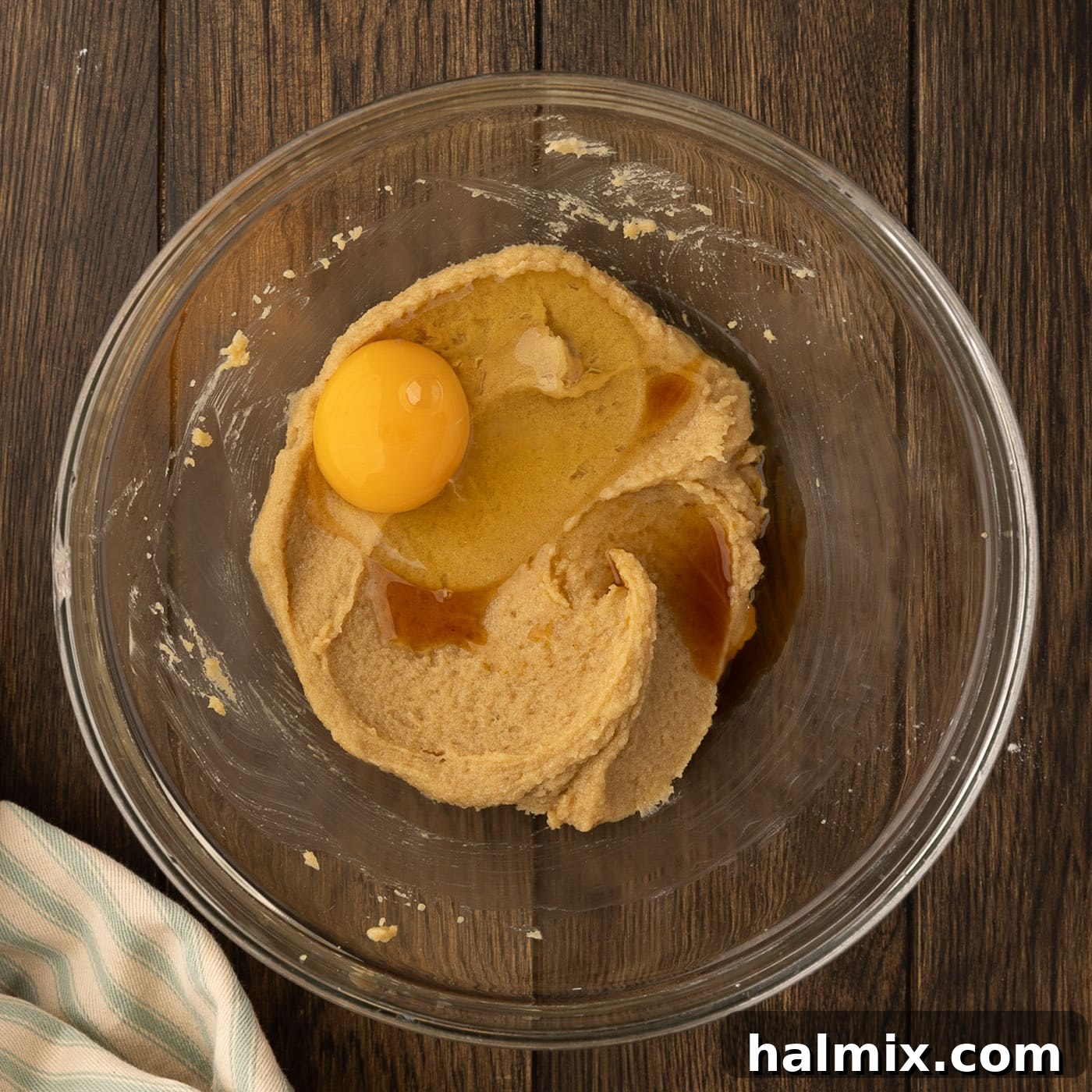 Decadent Caramel Chocolate Skillet 8 adding egg and vanilla to cookie dough