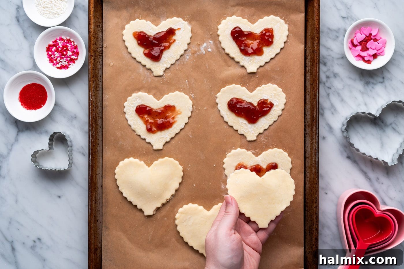 Sweetheart Pop Tarts 12 placing pie dough on top of jam filled crust
