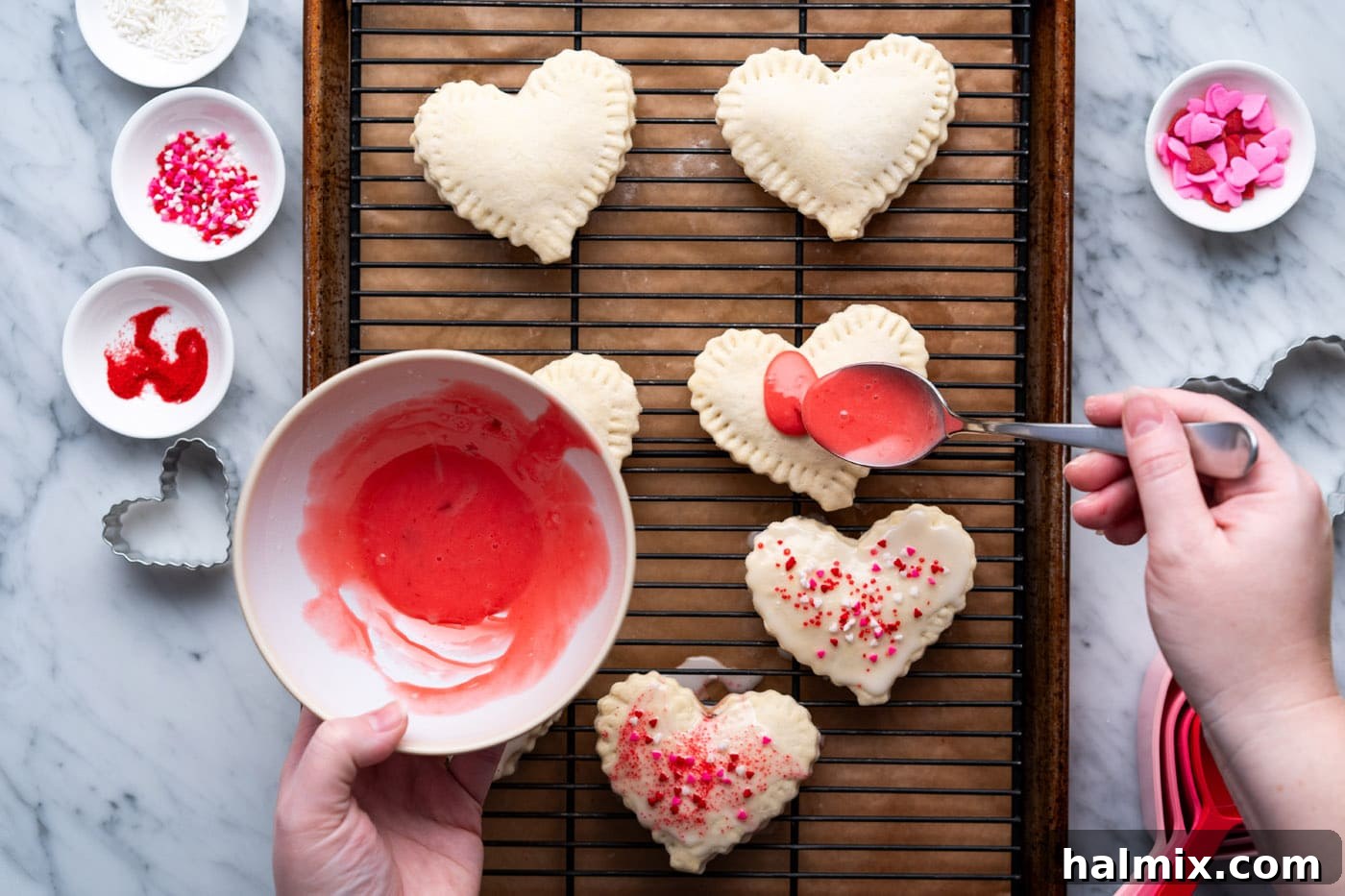 Sweetheart Pop Tarts 18 pouring red strawberry glaze over heart shaped pop tarts
