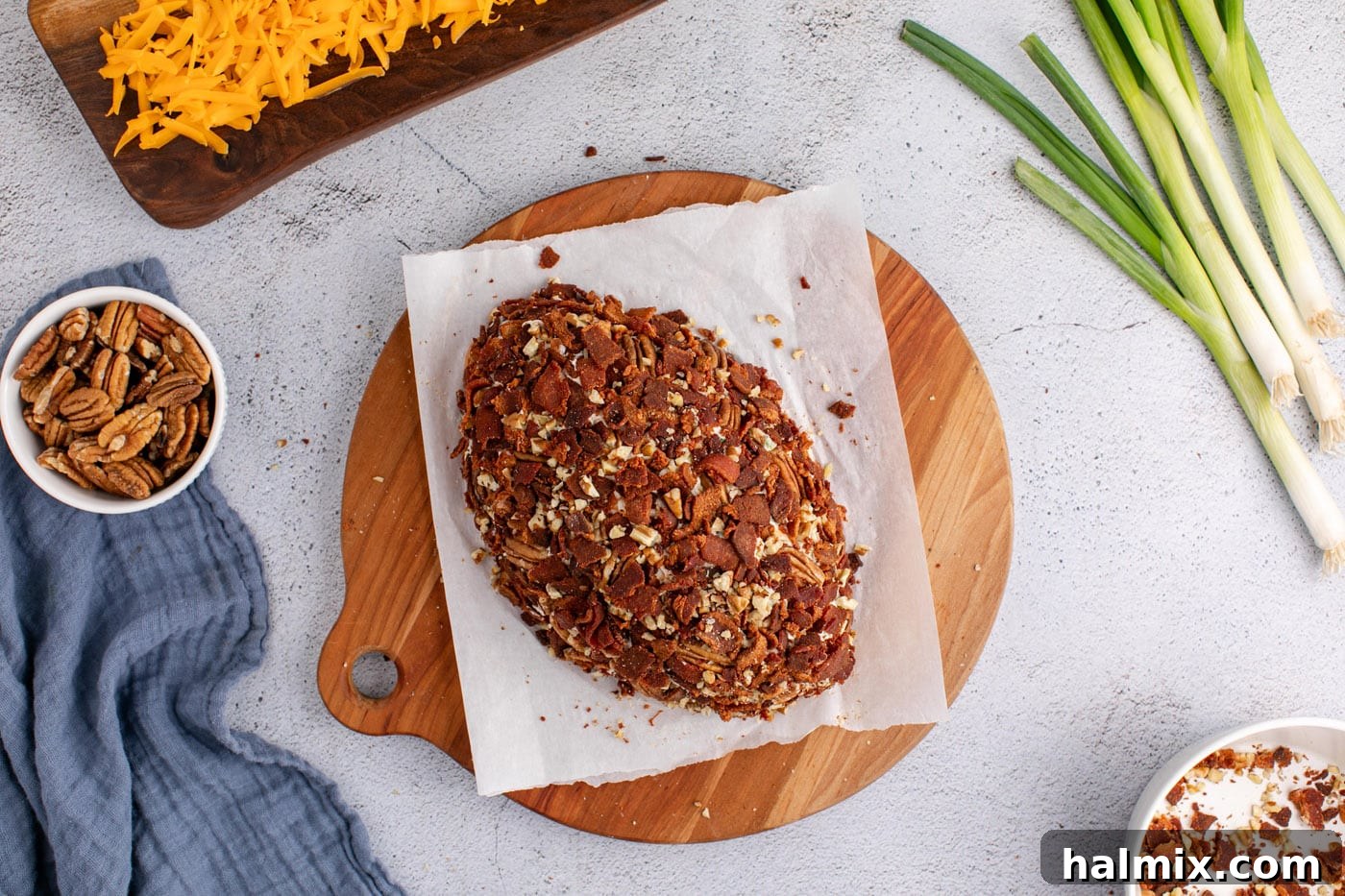 chopped bacon and pecans on top of cheese ball