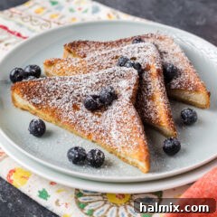 Three slices of Air Fryer French Toast on a plate