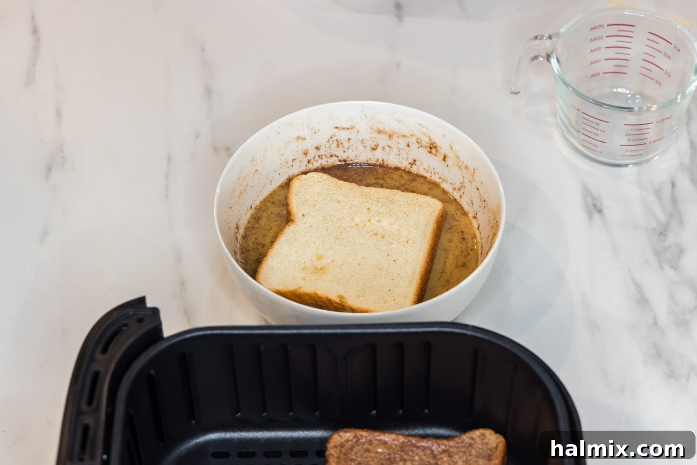 dipping bread into egg mixture