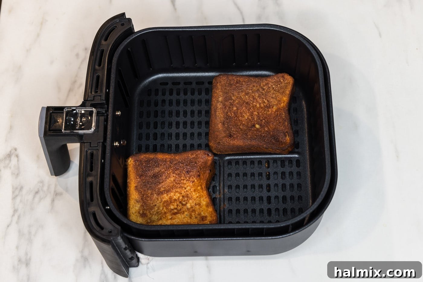 Cooked French toast in air fryer basket