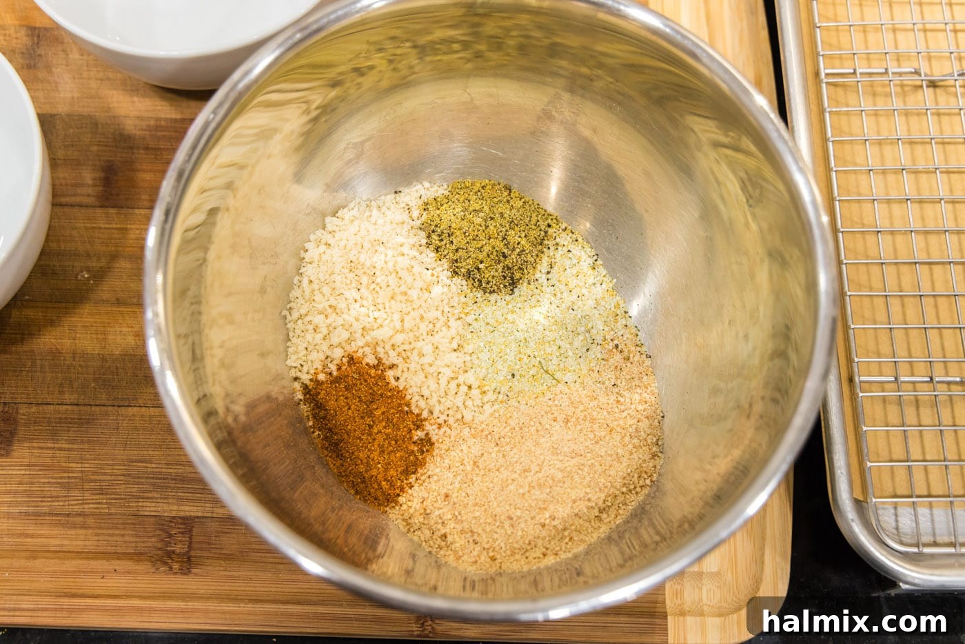 Panko, plain breadcrumbs, and seasonings mixed in a large bowl, ready for breading