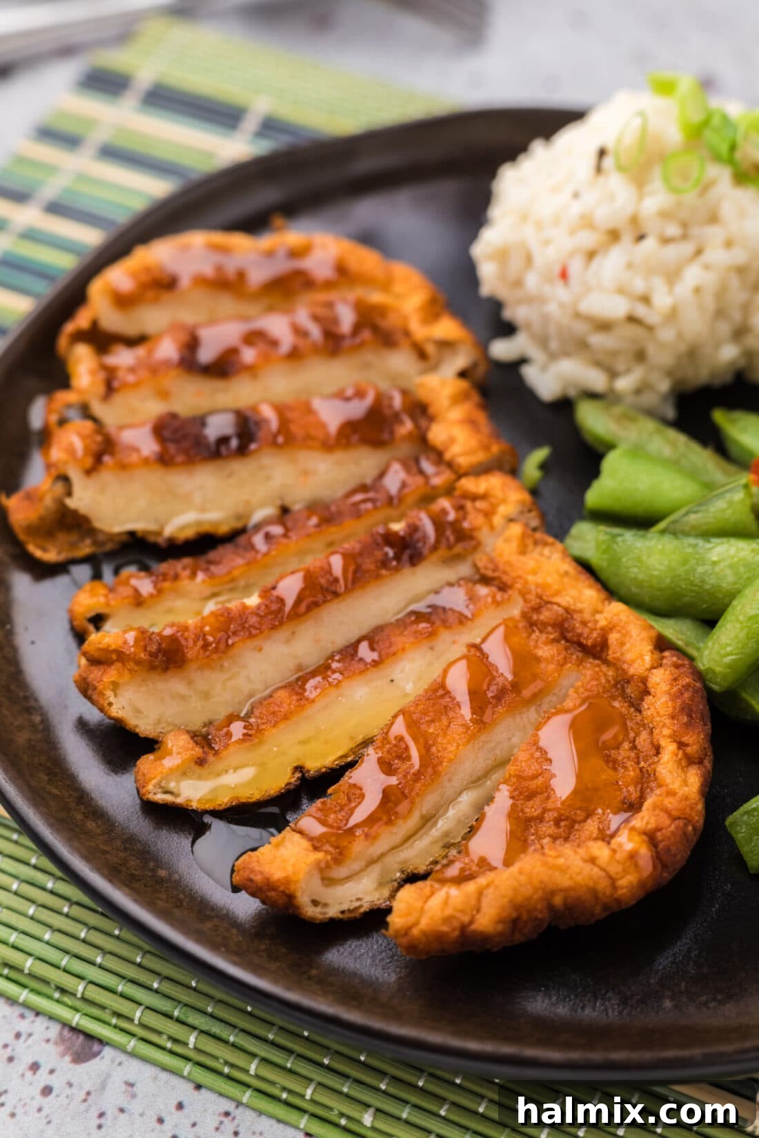 Close up photo of a Korean Fish Cake cut into slices on a plate