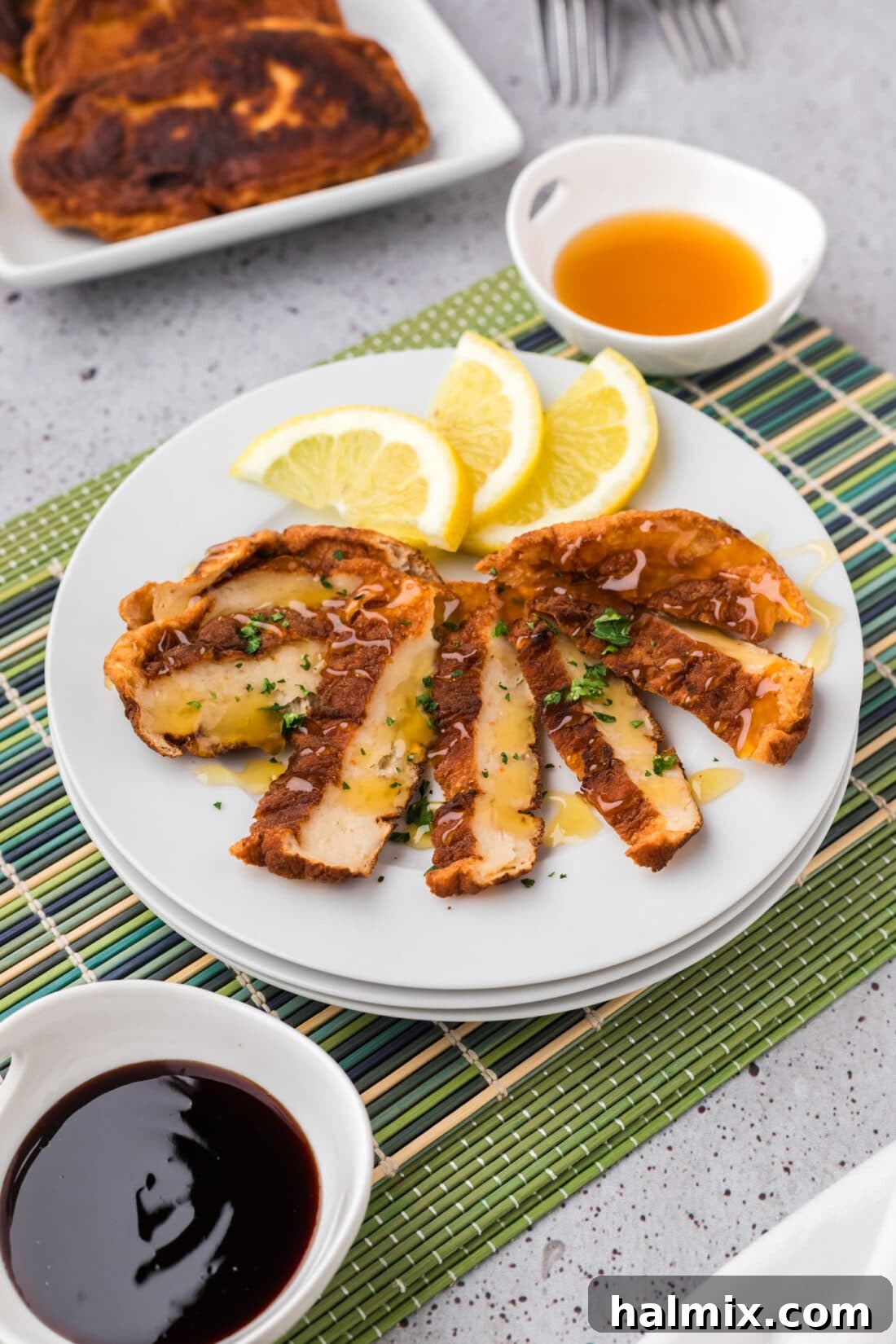 Sliced Korean Fish Cake on a plate with lemon slices