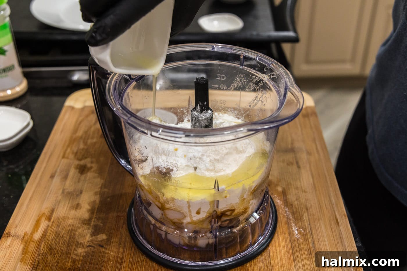 adding fish cake ingredients to a food processor