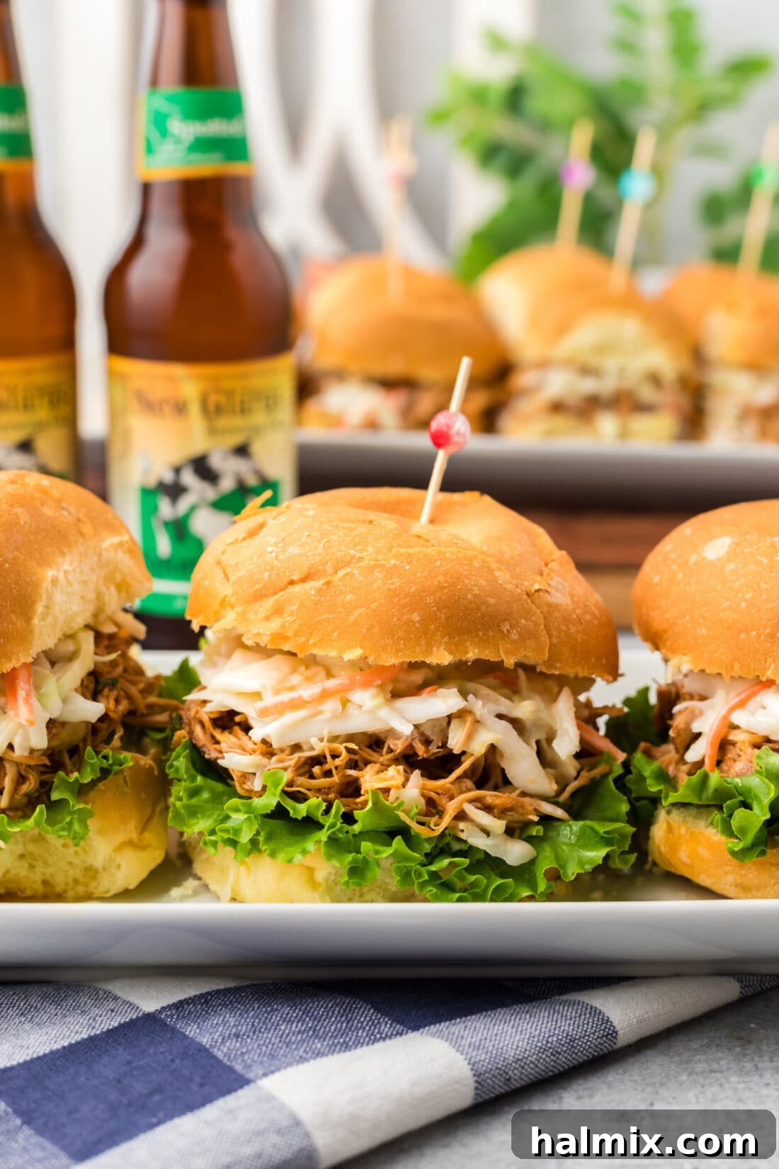 Close up photo of a mouth-watering BBQ Chicken Sandwich, highlighting the shredded chicken and potential toppings.