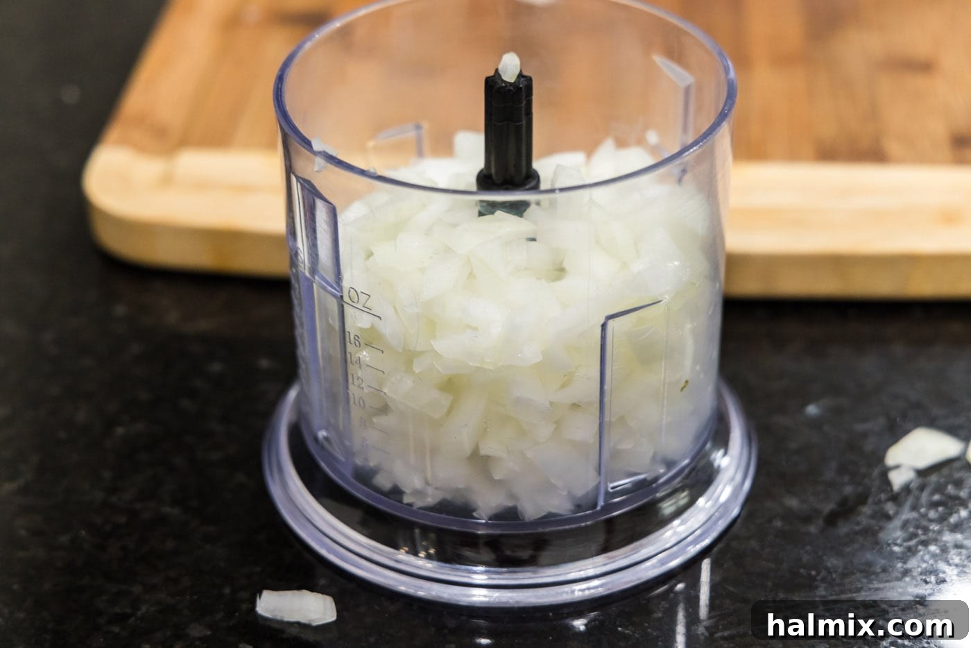Chopped onion being processed in a food processor