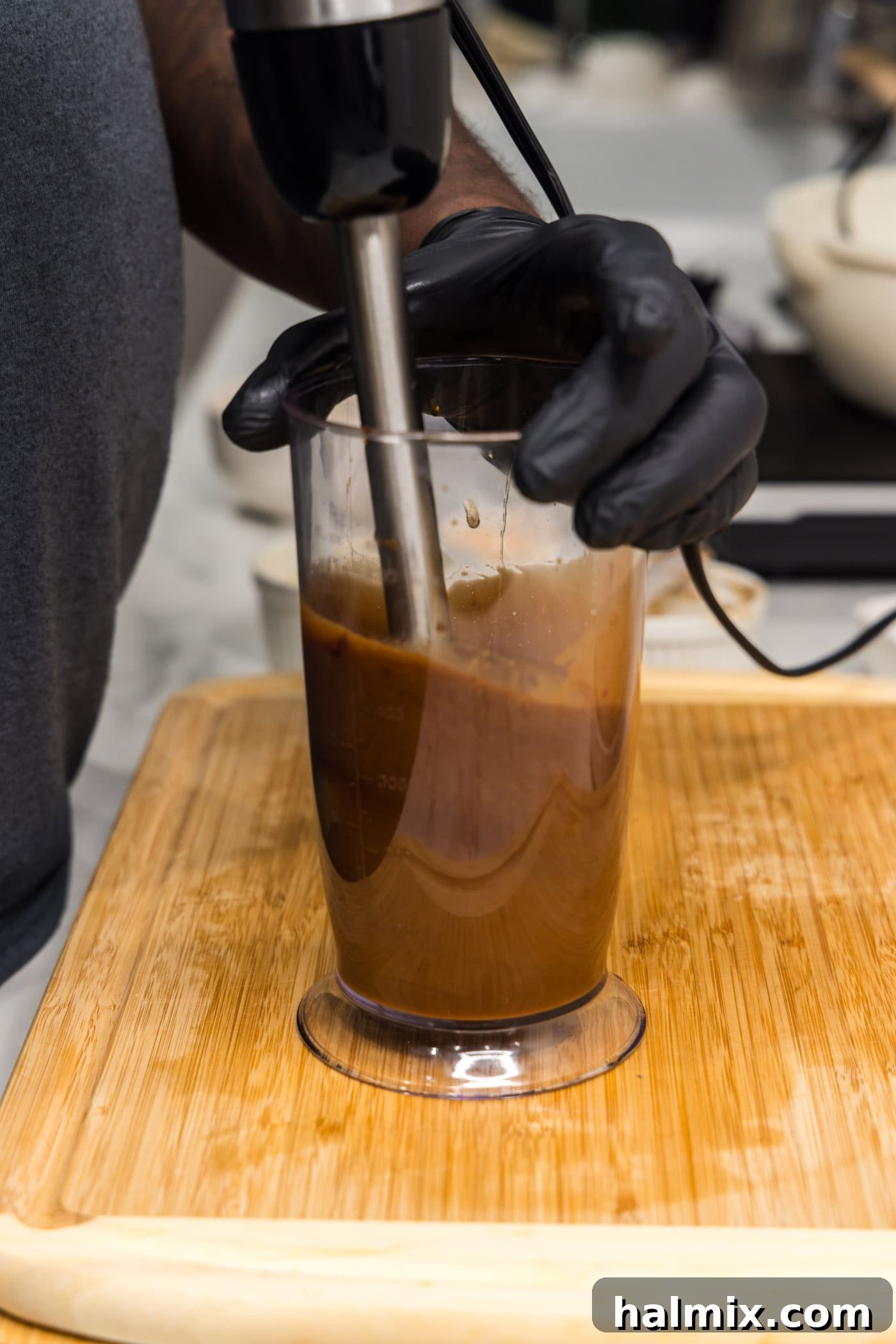 blitzing honey soy sauce marinade in an immersion blender