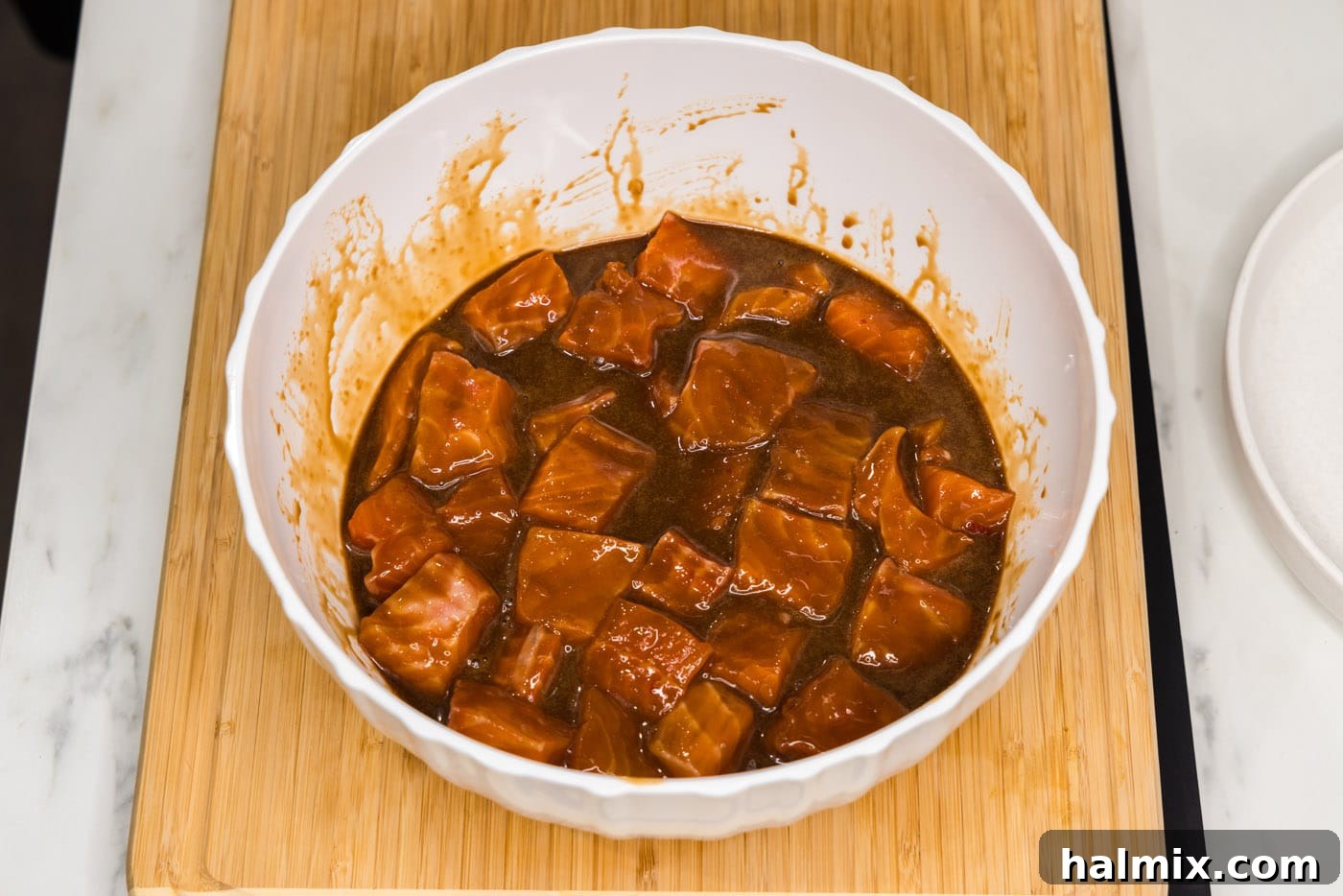 salmon bites marinating in a bowl