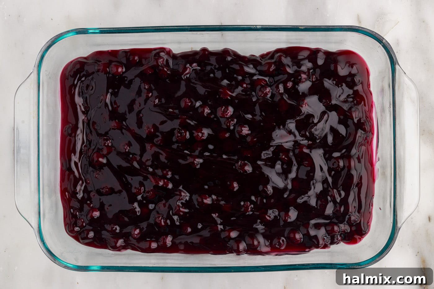 Blueberry Crumble Bake 5 Blueberry pie filling spread evenly at the bottom of a 9x13 baking dish