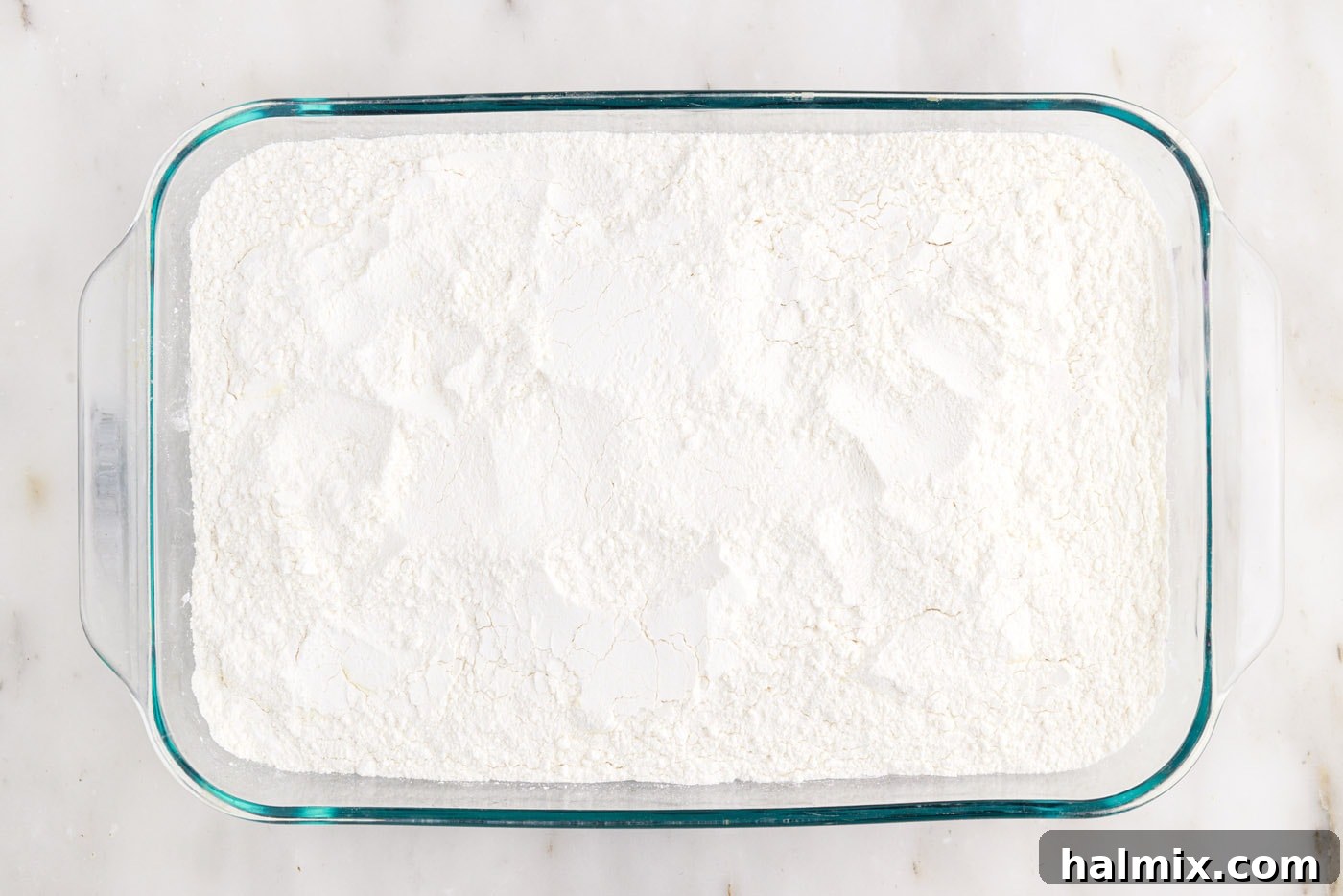 Blueberry Crumble Bake 6 Dry yellow cake mix sprinkled evenly over the blueberry pie filling in a baking dish