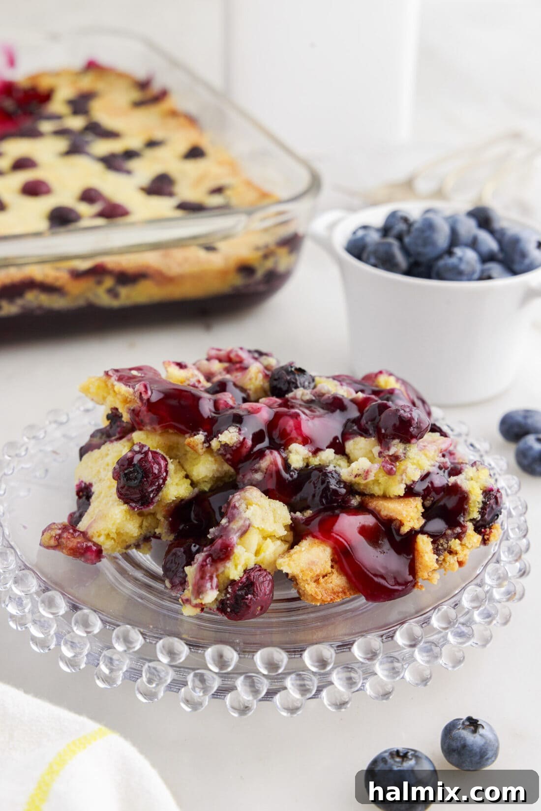 Blueberry Crumble Bake 10 Blueberry Dump Cake serving on a plate, ready to be enjoyed