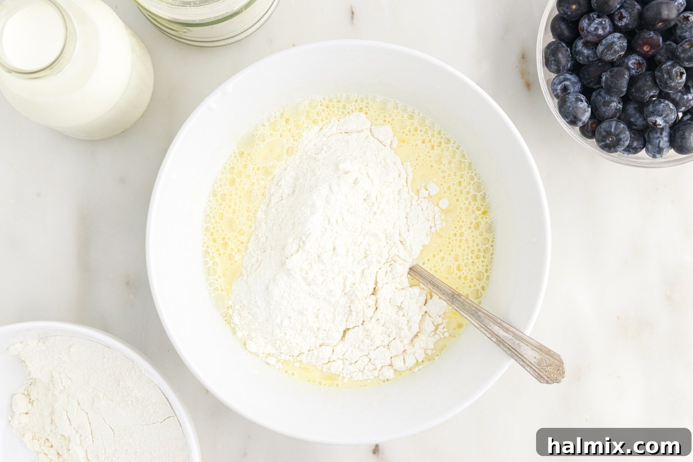 whisking wet and dry ingredients together in a bowl