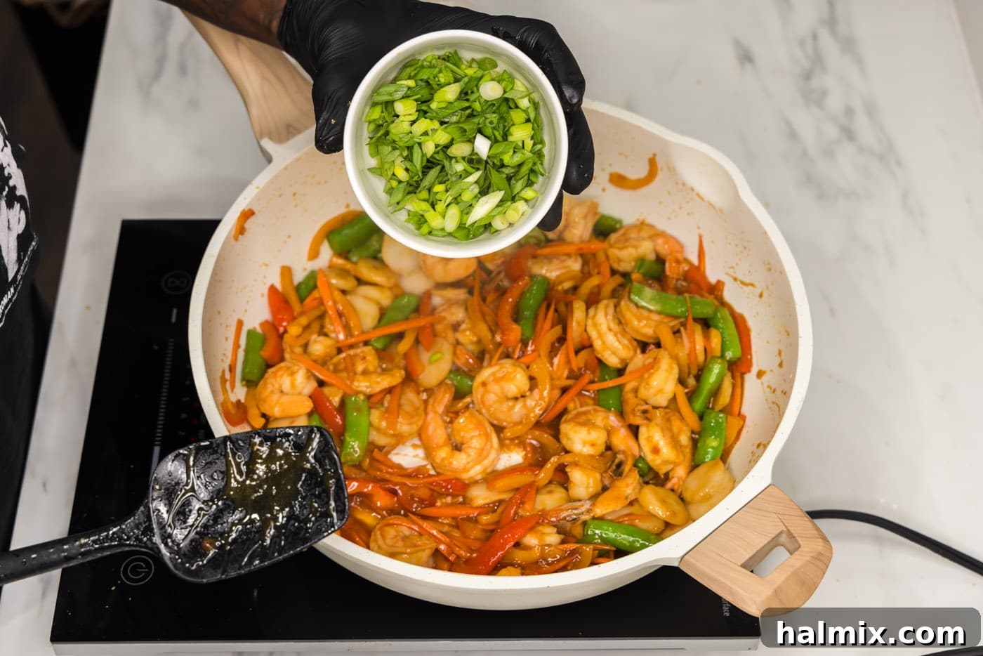 Sweet Chili Shrimp Stir-Fry 11 green onions over top skillet of shrimp and stir fry vegetables
