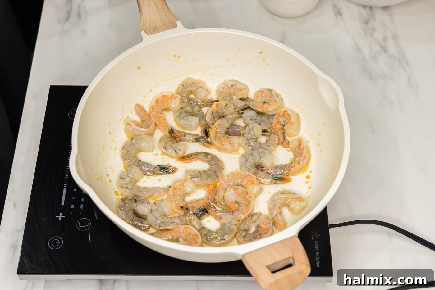 Sweet Chili Shrimp Stir-Fry 5 shrimp in a skillet with oil and garlic
