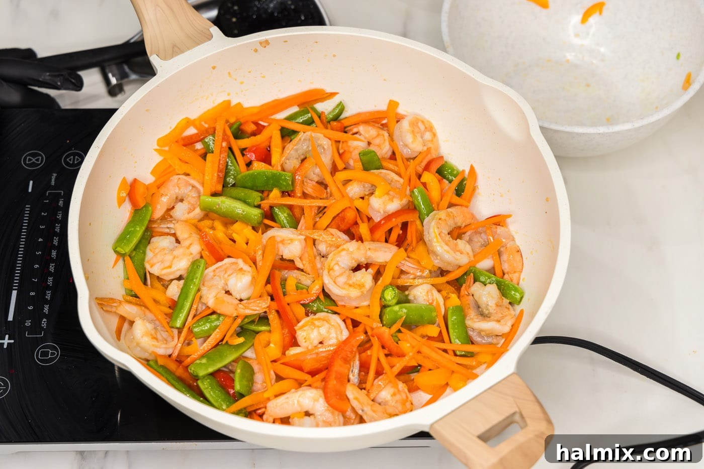 Sweet Chili Shrimp Stir-Fry 6 carrots, snap peas, and bell peppers added to skillet with shrimp