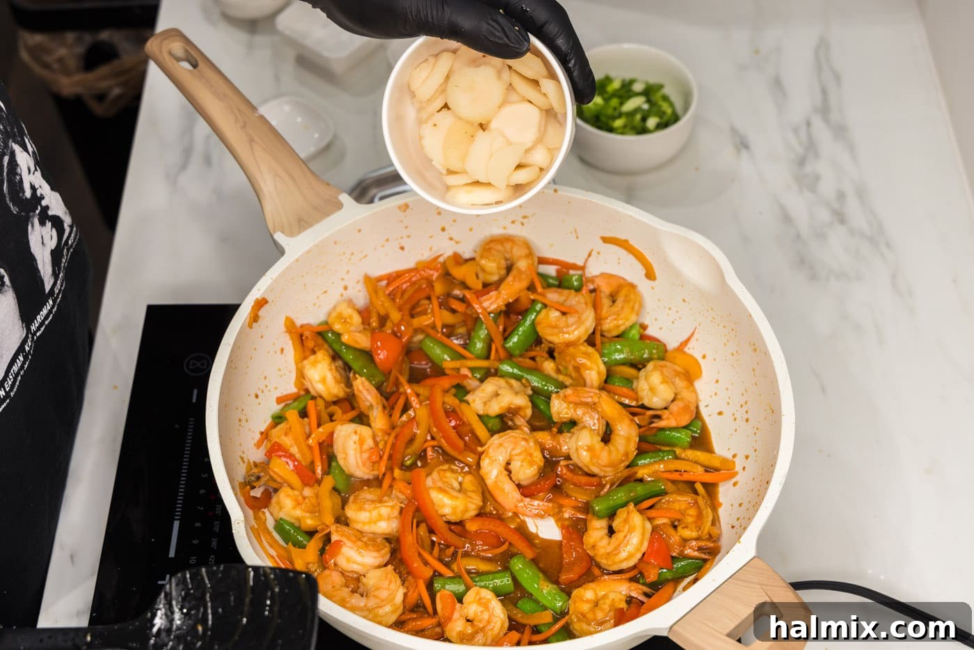 Sweet Chili Shrimp Stir-Fry 10 adding water chestnuts to skillet with shrimp and veggies