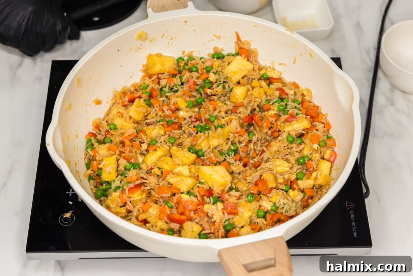 Fully cooked Pineapple Fried Rice in a skillet, ready to be served.