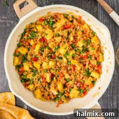 Overhead photo of Pineapple Fried Rice in a skillet, ready to serve.