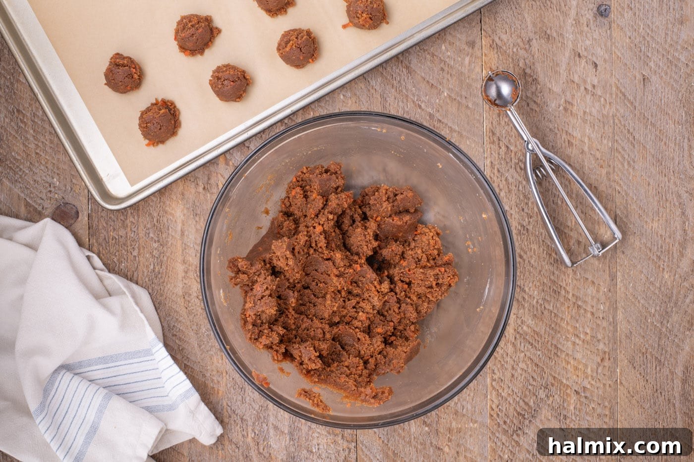 The combined carrot cake and cream cheese frosting mixture, ready to be rolled into balls