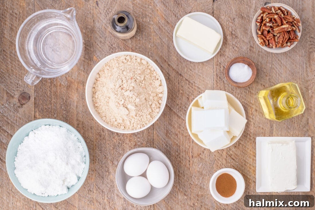 Assortment of ingredients laid out for making Carrot Cake Truffles, including cake mix, eggs, oil, butter, cream cheese, and powdered sugar