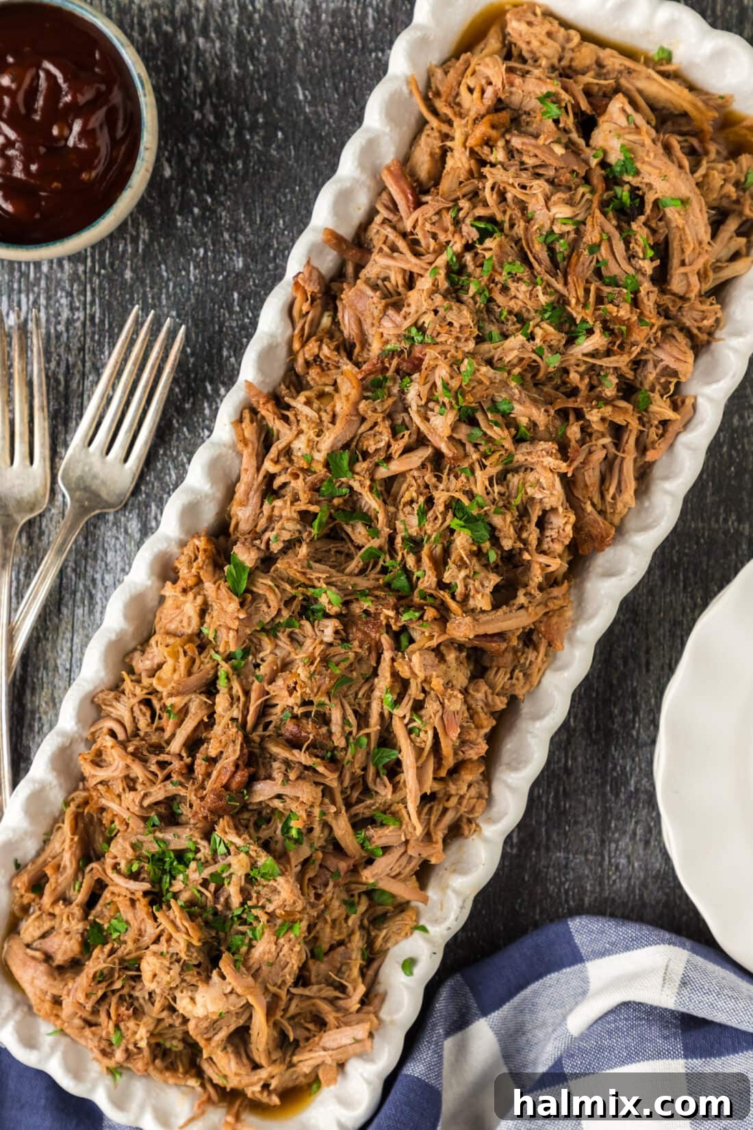 Pulled Pork on a platter, garnished and ready to serve