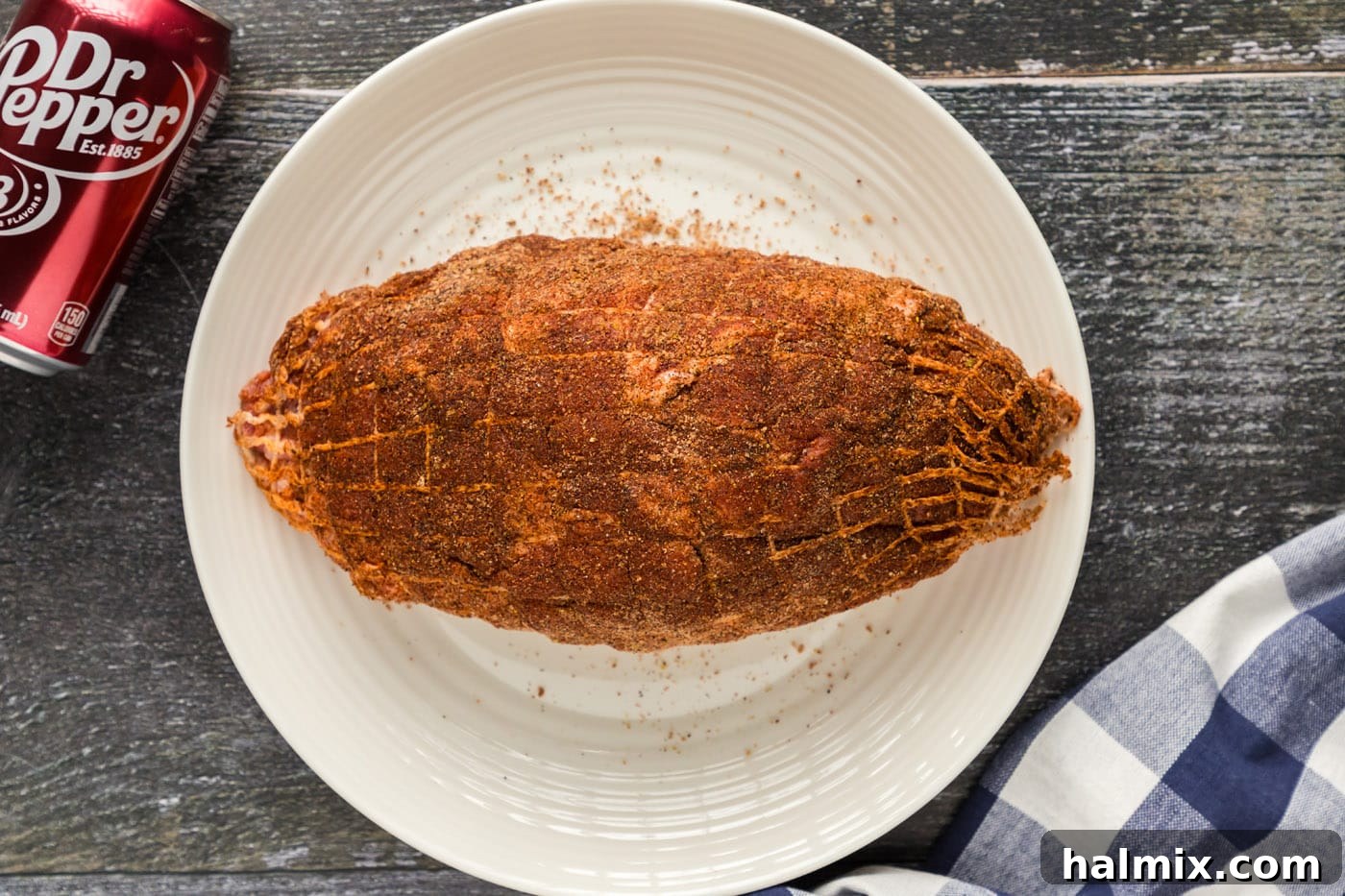 pork shoulder with dry rub applied generously