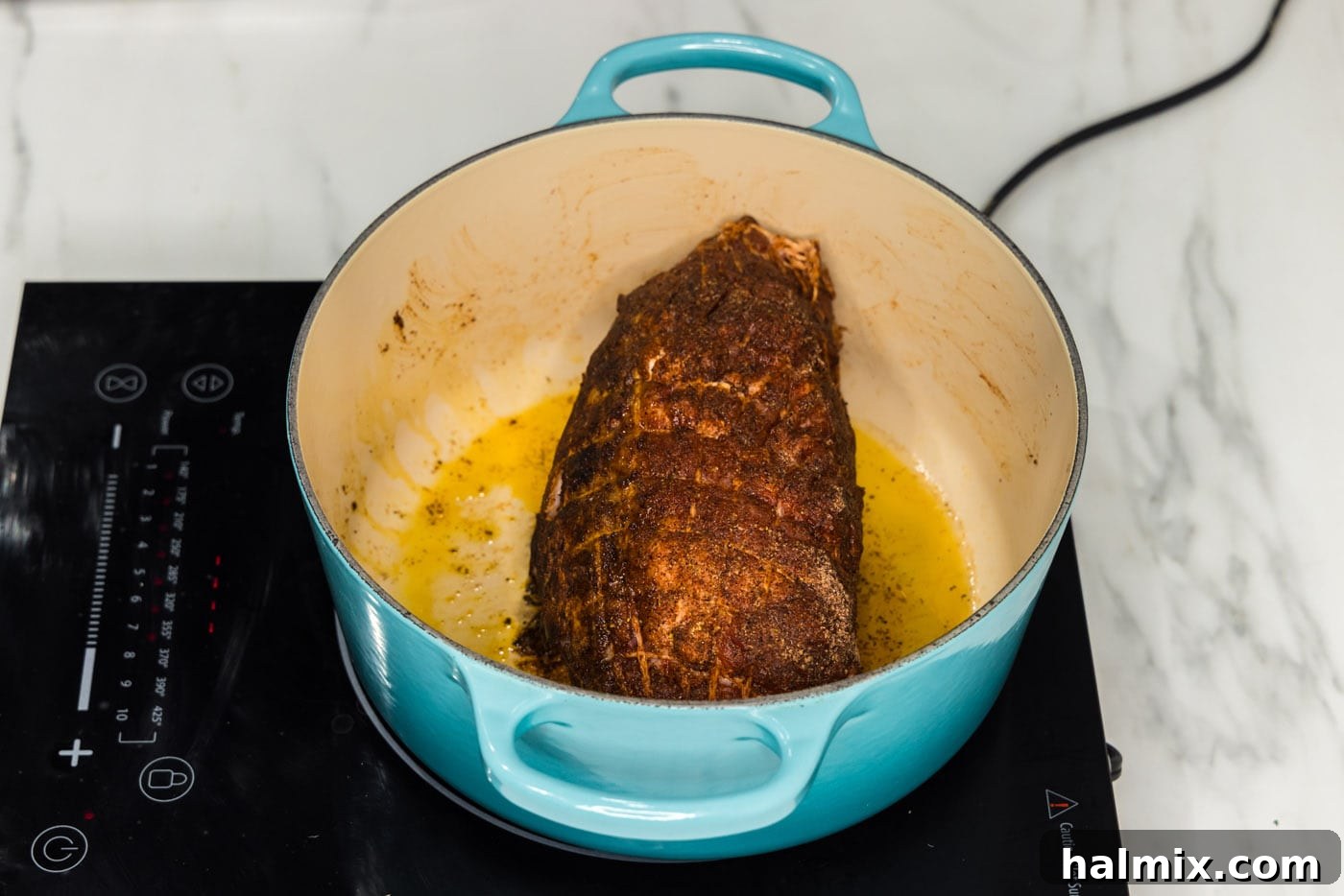 searing pork shoulder in a dutch oven on the stovetop