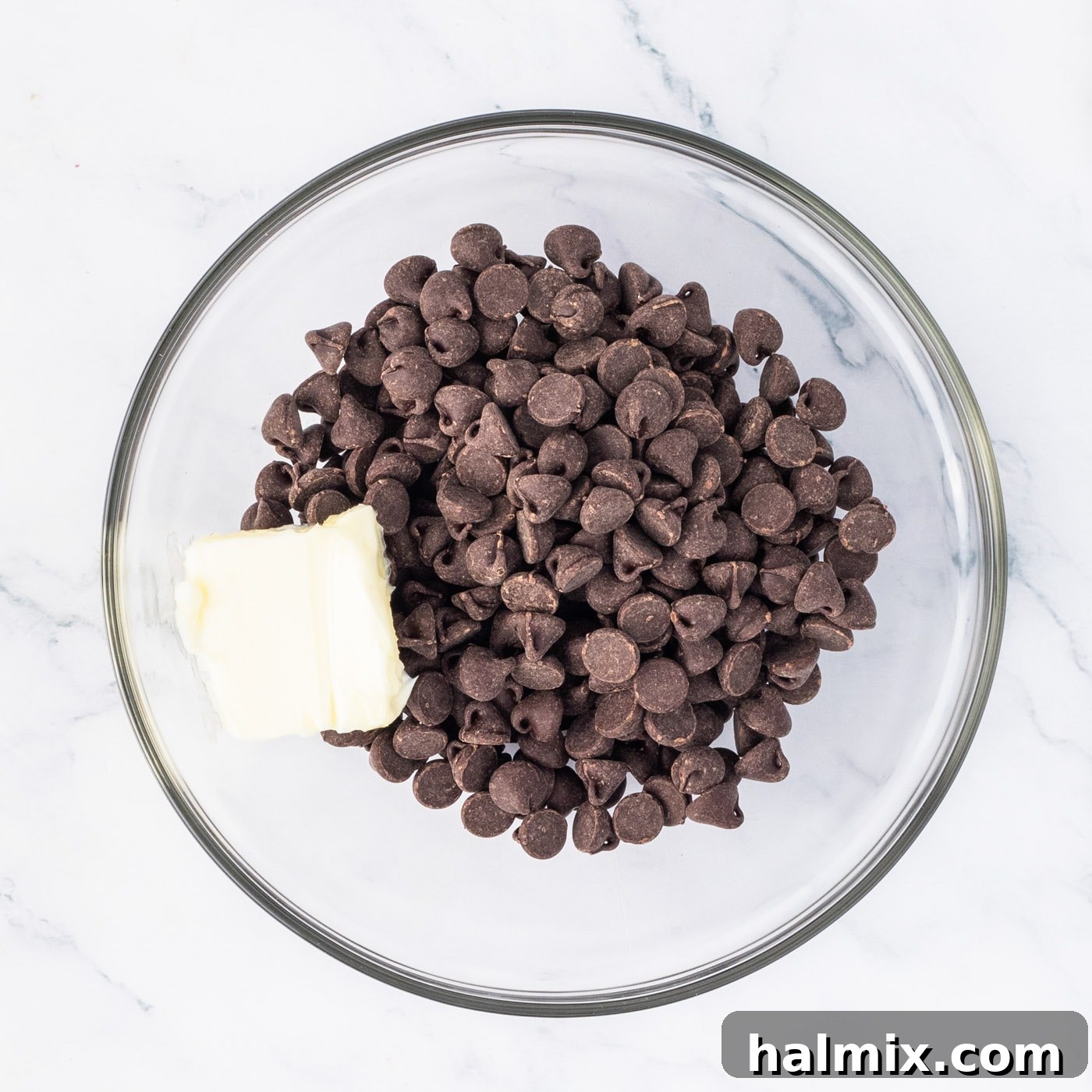 semi sweet chocolate chips in a bowl with butter