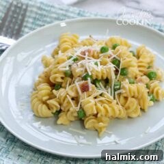 Rotini with Peas and Cheese on a plate, ready to be served.