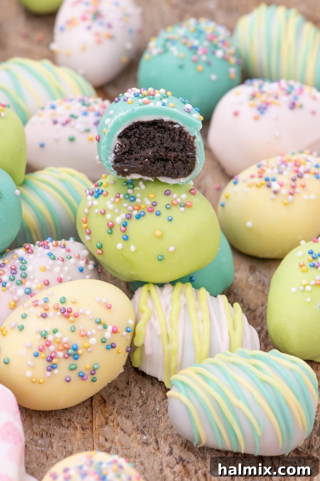 Delightful Easter Egg Oreo Truffles 3 Easter Egg Oreo Truffles with a bite taken out of one