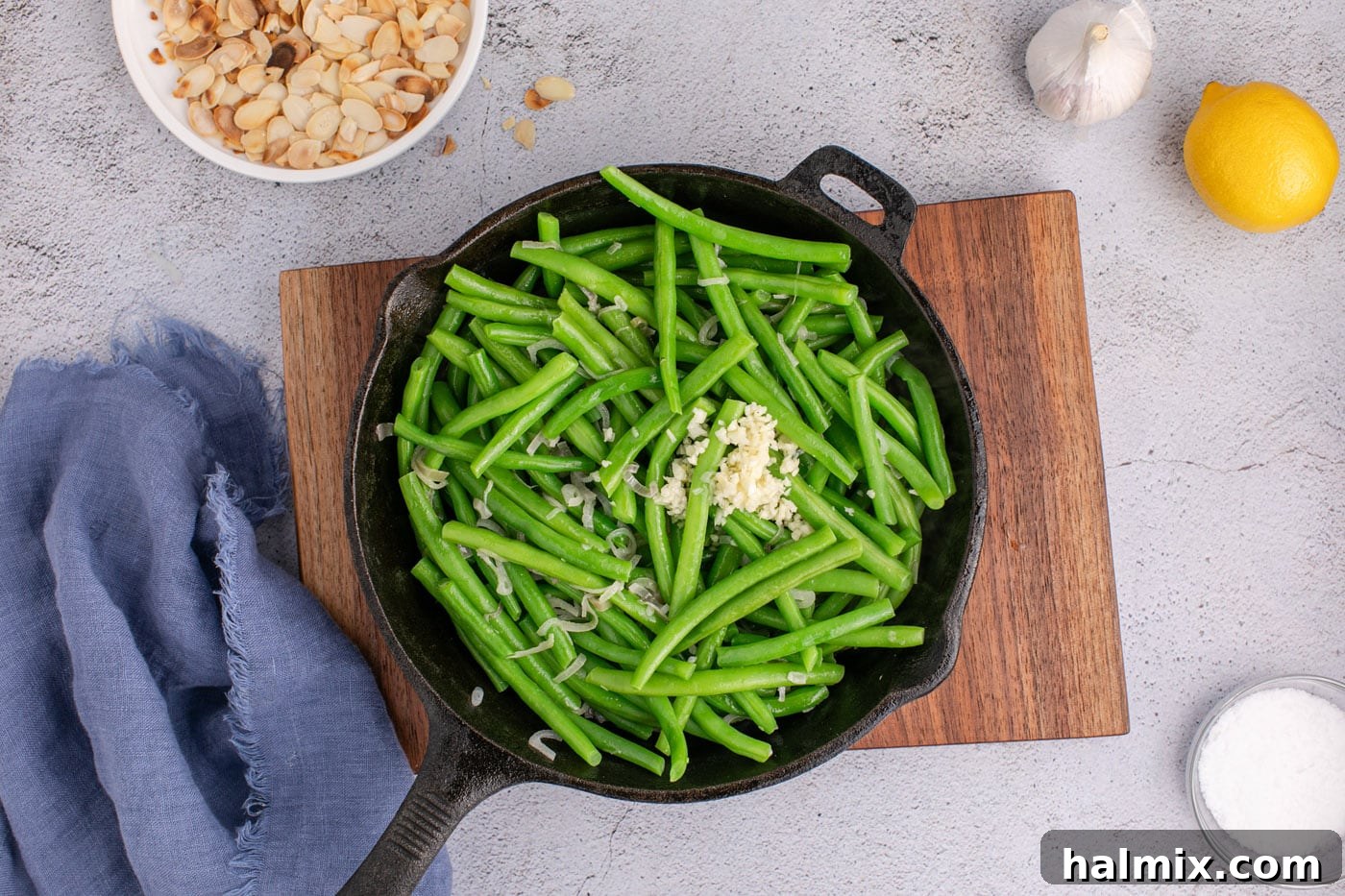 skillet of green beans with garlic and lemon juice