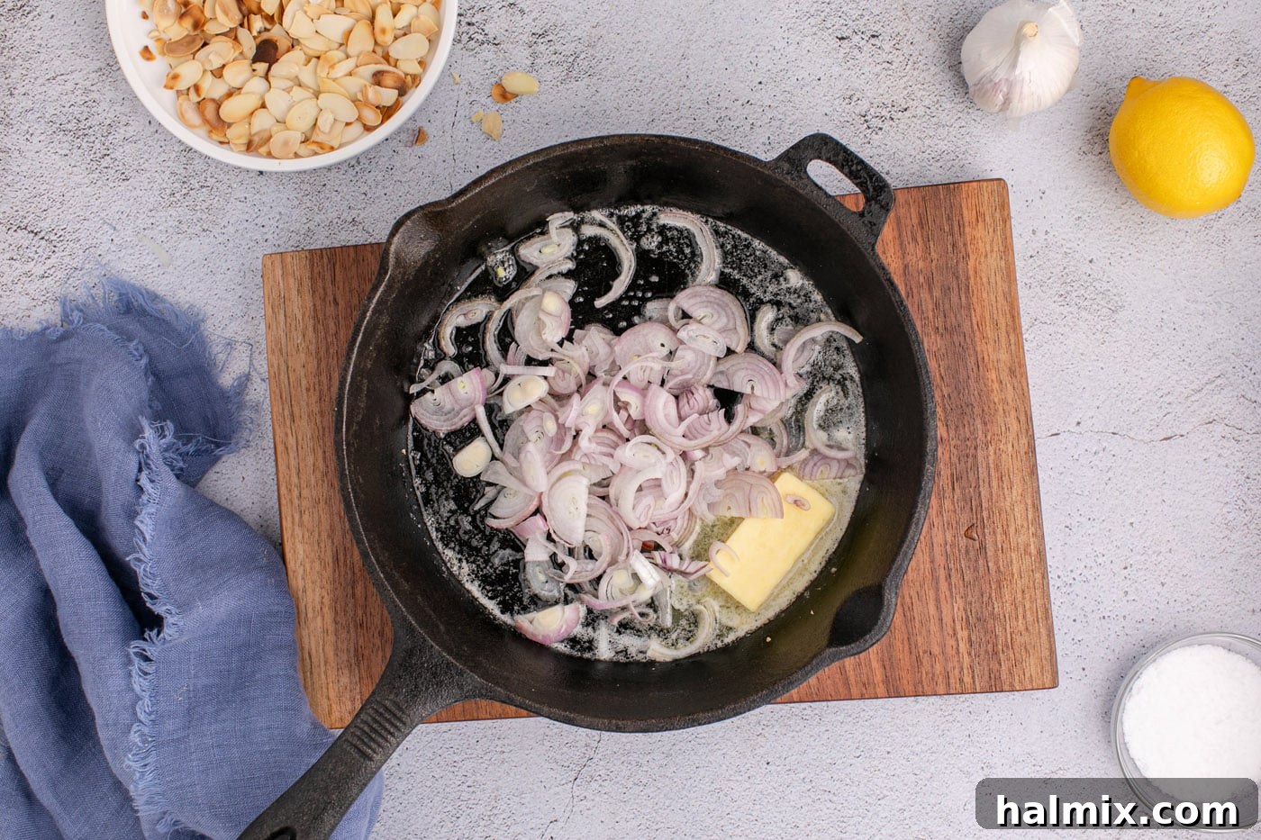 shallots added to butter in a skillet