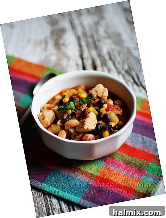 Hearty Chicken Chili with Black Beans and Sweet Corn 2 A vibrant bowl of chicken chili, rich with black beans and corn, promises warmth and flavor.
