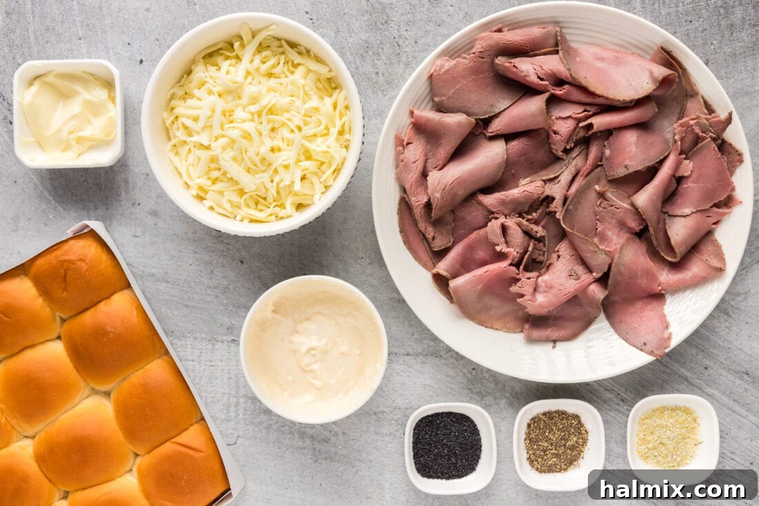 A flat lay photograph showcasing all the fresh ingredients needed for Roast Beef Sliders, neatly arranged on a counter