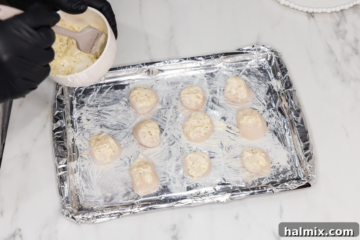 Golden Broiled Scallops 7 Brushing individual scallops with the seasoned butter mixture.