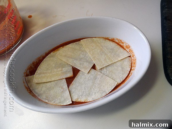 Overhead shot of the prepared chicken mixture, ready to be layered into the tostada casserole.