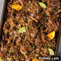 Crispy Instant Pot Carnitas 16 Close up photo of Instant Pot Carnitas on a sheet pan