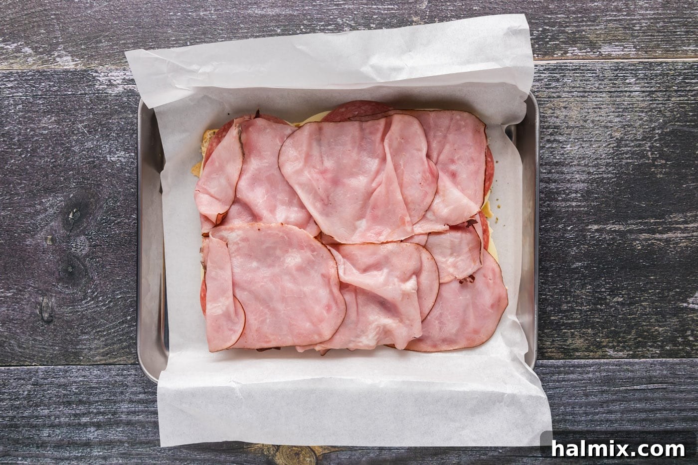 Deli ham layered over salami and provolone cheese.