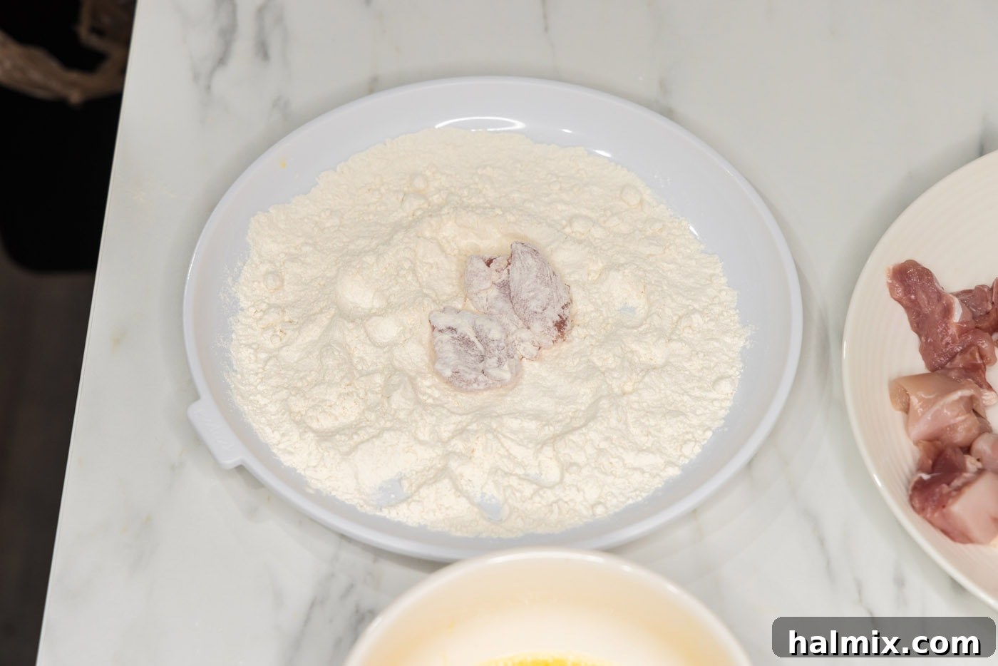 dredged chicken pieces in flour